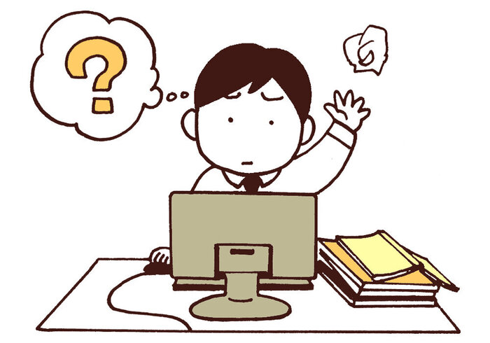 デスクワークで困っている男性